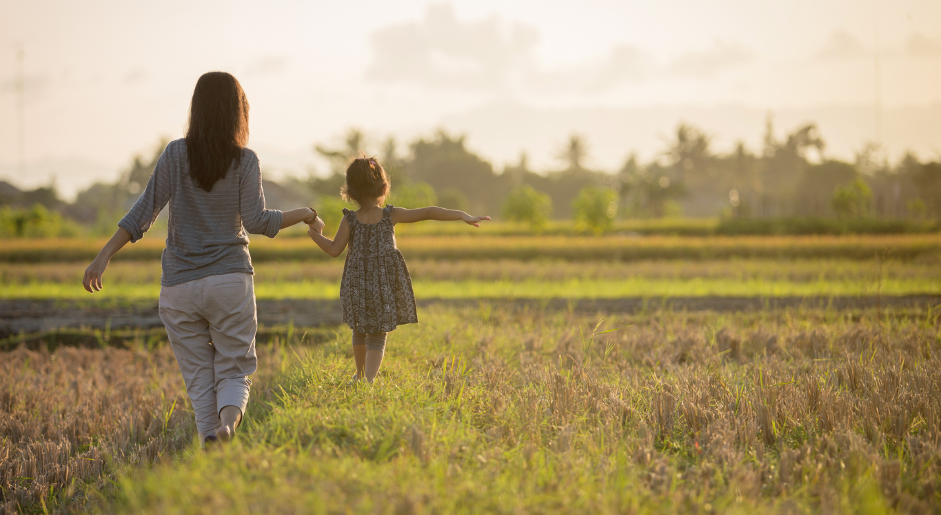 Mom and child in field