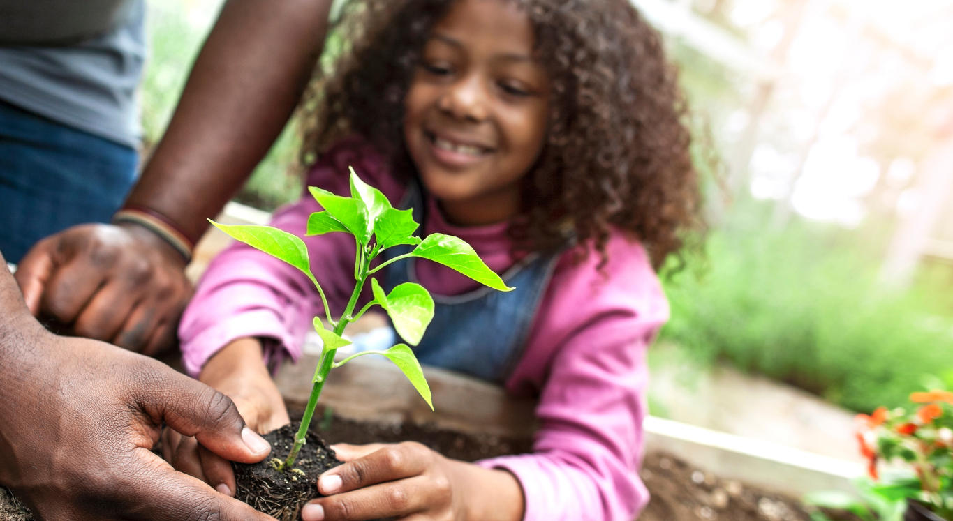 girl planting greenery