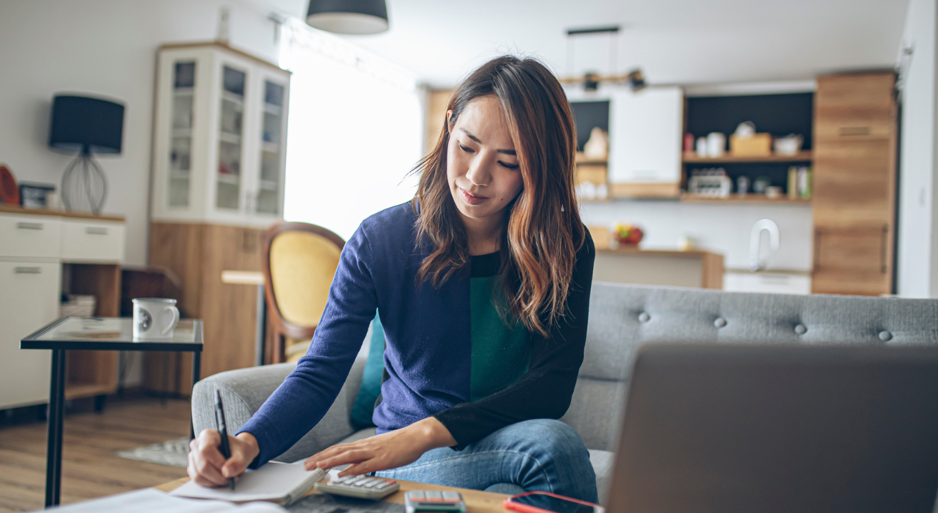 Woman doing her finances at home.